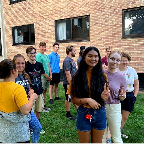 Honors LLC students gathering in Bridgman Hall's backyard
