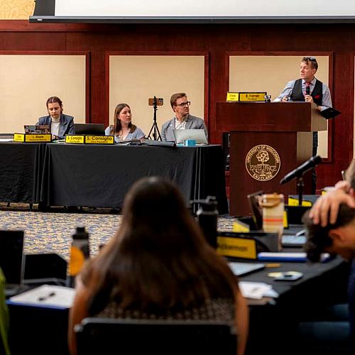Student senate in session, enrollment management director Billy Felz at podium